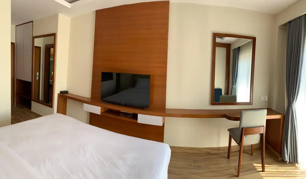 Superior room with timber feature wall and vanity desk